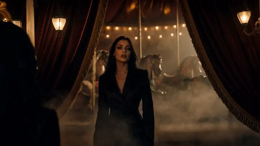 Woman in a flowing dress in a cinematic scene.